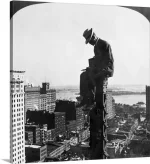 construction-photographer-1907-sitting-at-the-top-of-a-column-of-a-new-building.webp