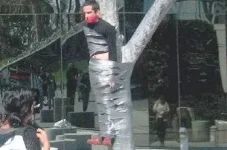 crazy-man-tied-to-tree_01.webp